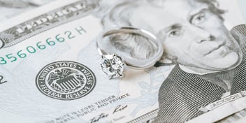 picture of twenty dollar bill and diamond ring