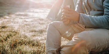 person relaxing in nature and sunlight