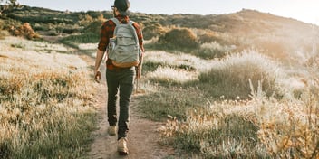 young man backpacking mountain trail nature