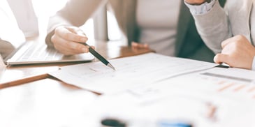 woman poring over financial papers