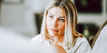 woman concentrating and looking concerned