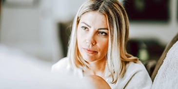 woman concentrating and looking concerned