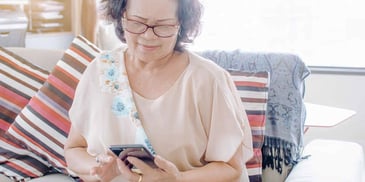 woman searching for a process server on her phone