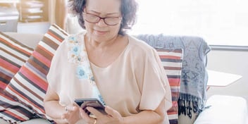 woman searching for a process server on her phone