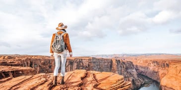 woman overlooks cliff
