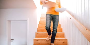woman moving things in home
