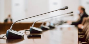 closeup view of courtroom microphones