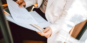 woman holding legal separation papers