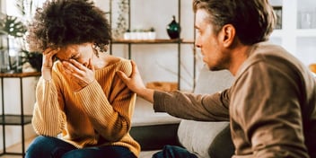 husband tries to comfort crying wife