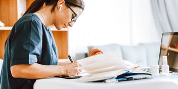 woman writing in journal
