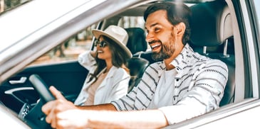 man driving woman riding white car white clothes