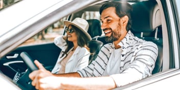 man driving woman riding white car white clothes