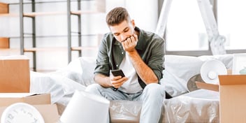 empty house with man on couch