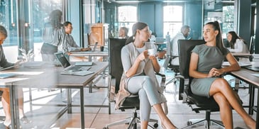 woman at an office chatting during a coffee break