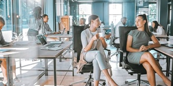 woman at an office chatting during a coffee break