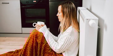 pensive woman with cup of coffee or tea