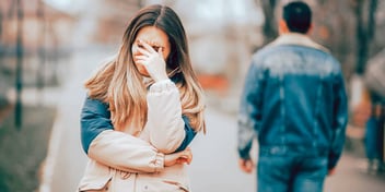 woman exasperated by man as he walks the opposite direction