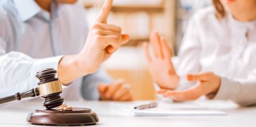 couple arguing over a legal matter at a desk