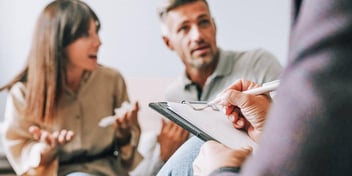 arguing spouses meeting with a mediator