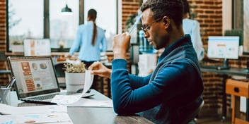young black male doing paperwork