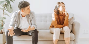 Couple argues about divorce on couch