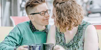 couple on a coffee date gazing into each other's eyes