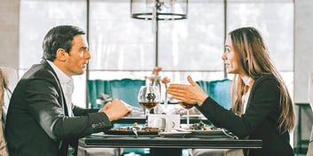 ex spouses discussing things over dinner