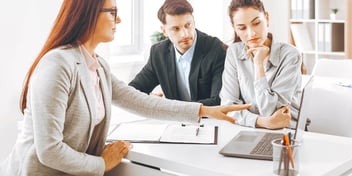 couple meeting with a legal professional in her office