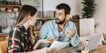 man and woman working in paperwork together