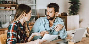 man and woman working in paperwork together