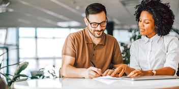 couple writing up a postnuptial agreement