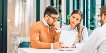 couple reviewing divorce paperwork