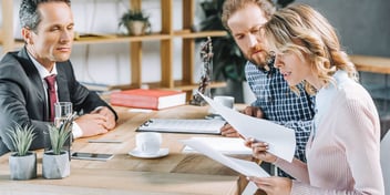 man and woman look over their attorney fees