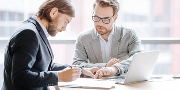 Divorce lawyer meets with client to review documents