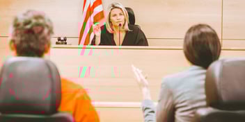 couple in divorce court speaking to a judge
