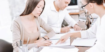 woman reviews spousal support paperwork