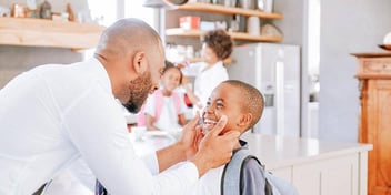 co-parents spending time together with their kids at home