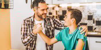 father and son embracing