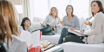 female friends drinking wine at a pity party