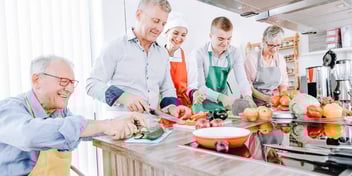 family cooking together in a kitchen