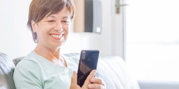 woman gets off a productive call about her divorce
