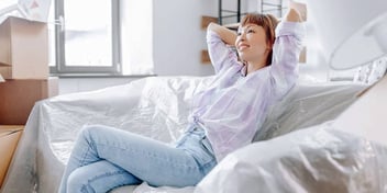 woman relaxing in her new home