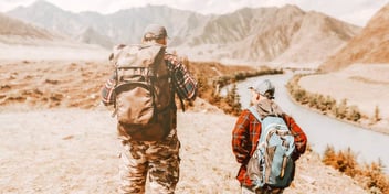 father and son hiking in the desert