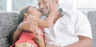 Hispanic dad and daughter hanging out