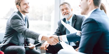 lawyers meeting with clients and shaking hands after a win