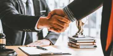 legal meeting people shaking hands