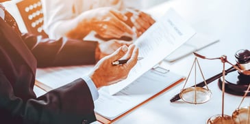 people reviewing legal paperwork
