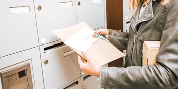 person holding divorce papers they just received by mail