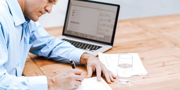 man working on his post-divorce finances and budget