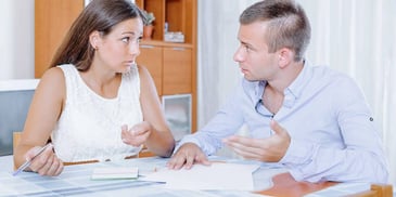 Man and woman having a tense discussion